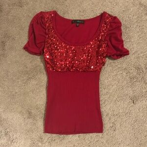 Red sequin short sleeve,  tight ribbed under breasts.